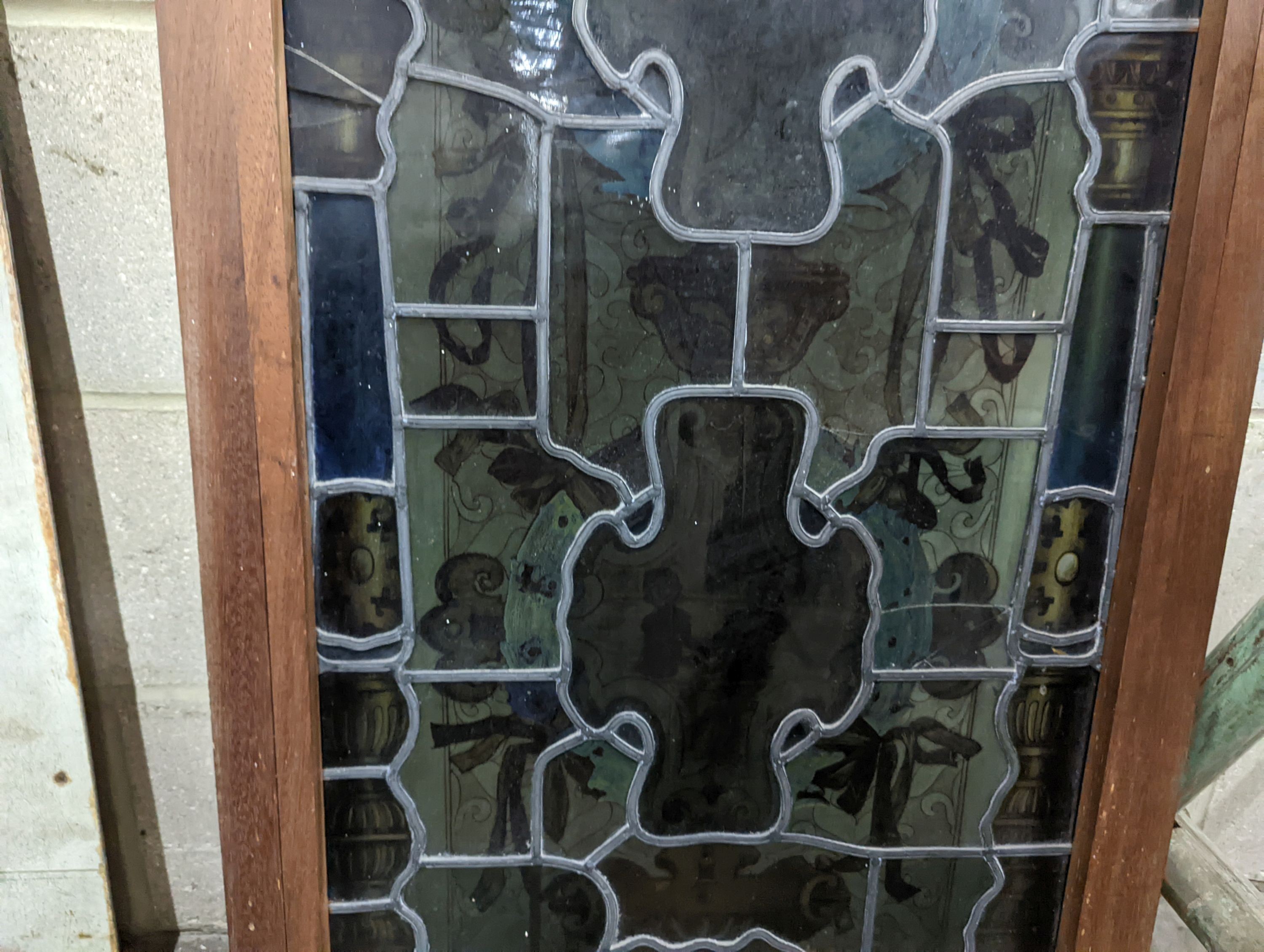 A rectangular stained glass panel, width 56cm, height 99cm including frame